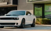 white challenger parked in front of cornerstone store