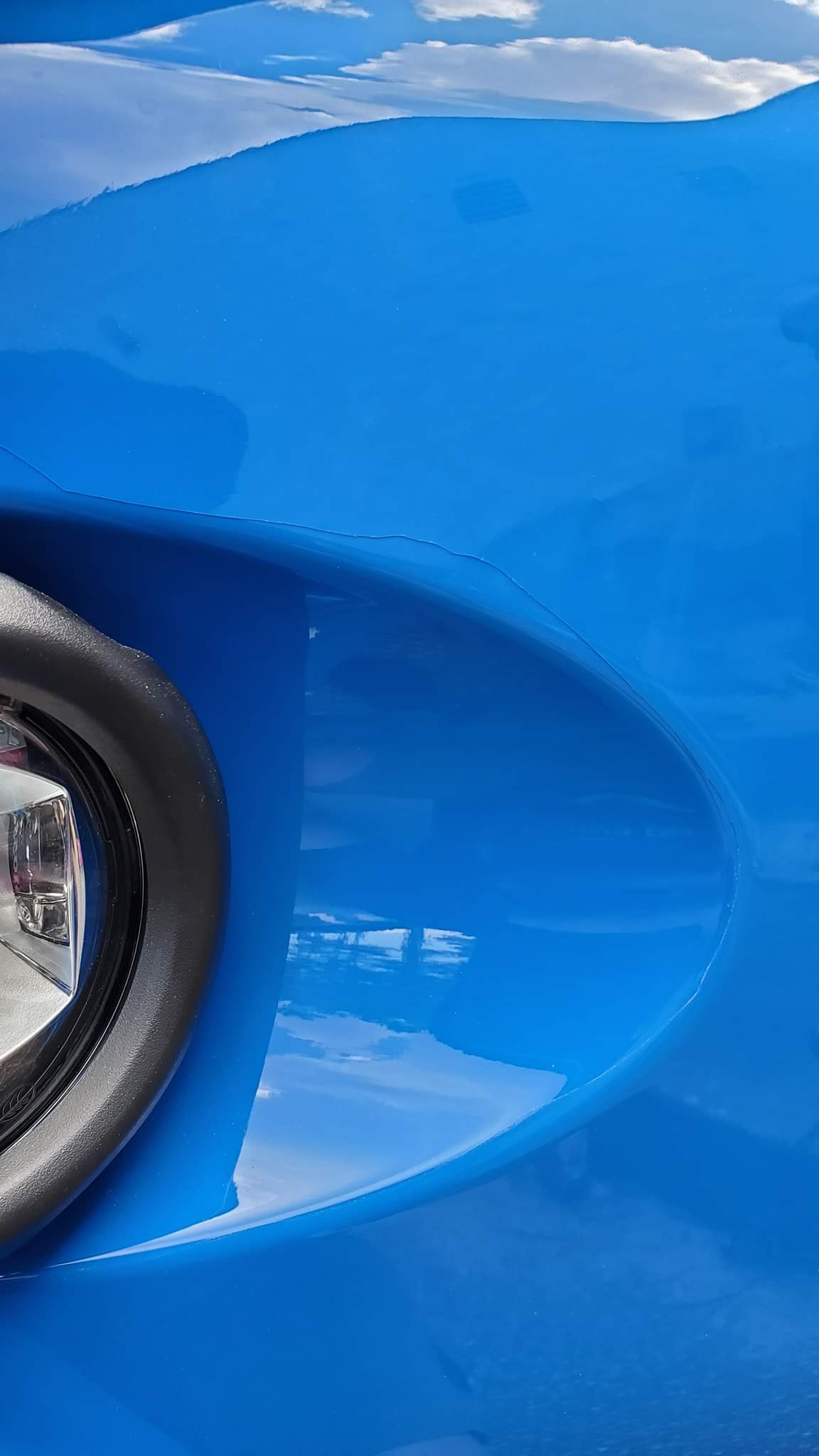bad ppf installation on a blue car